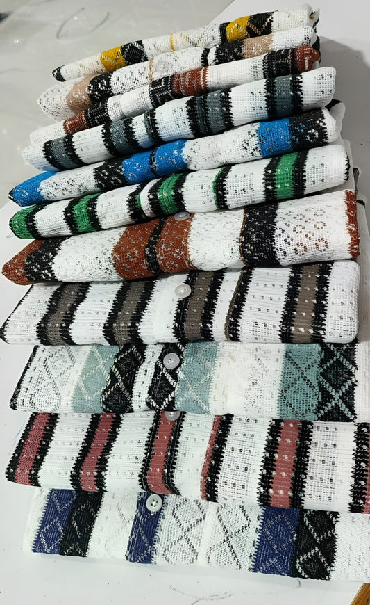 Stack of colorful knitted fabric swatches on a white background